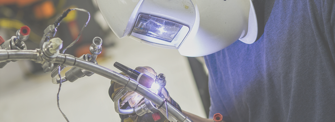 Precision Aerospace Welding - High-Quality Component Fabrication A welder using precision TIG welding techniques to join aerospace tubing, ensuring high-strength and leak-proof connections for critical applications.